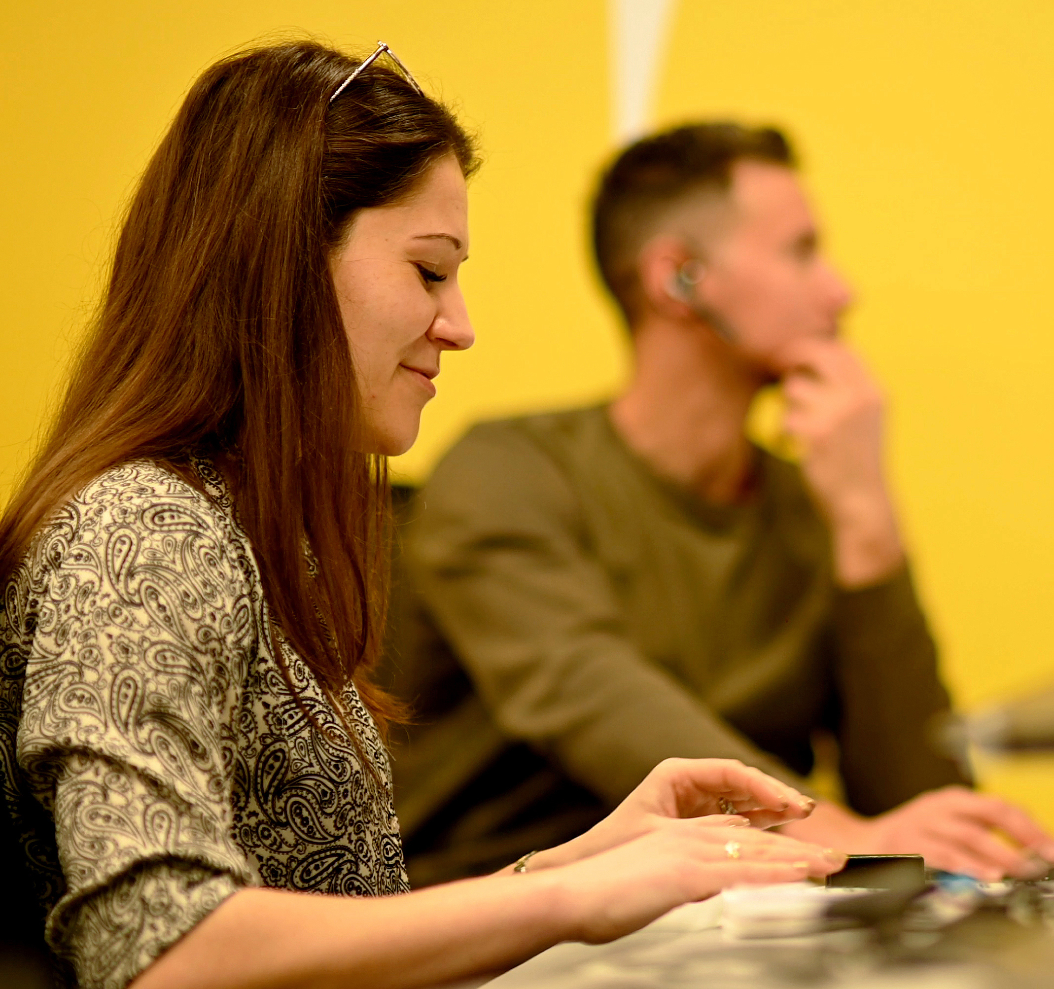 People in a meeting together making notes and working